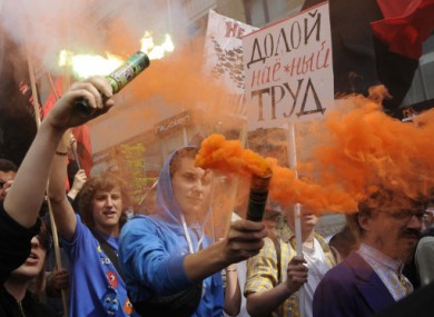 Left wing activists shout slogans during a rally marking May Day in Kiev, Ukraine, today.