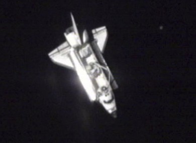 A photo made from NASA video shows Endeavour over the western Pacific as it approached the ISS today.
