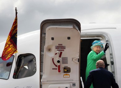The Queen waves to the assembled dignitaries as she and Prince Philip prepare to leave Cork Airport earlier today.