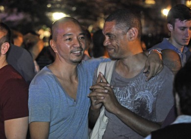 A couple celebrate in Manhattan following the passing of the law.
