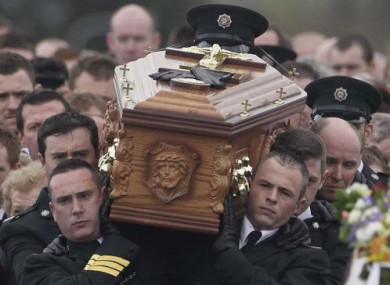 The coffin of PSNI officer Ronan Kerr is carried through his home town of Beragh, Co Tyrone, 6 April 2011.