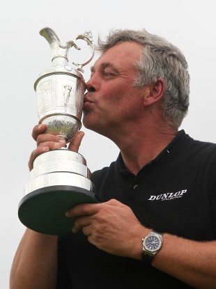 Darren Clarke kisses the Claret Jug after his British Open success.