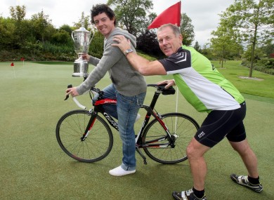 Golfer Rory McIlroy and charity fundraiser Drew Wylie in Co Down yesterday.