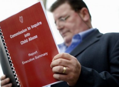 Abuse survivor John Kelly reading the findings of the Ryan Commission in May 2009.