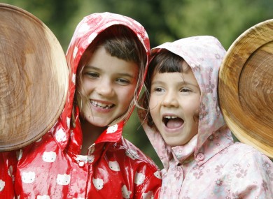 Sisters Aoife (6) and Tara Clark (5) from Harold's Cross have a laugh while attending various Heritage Week events in Merrion Square, Dublin today.