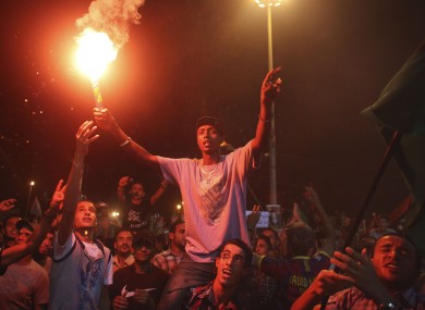 People in Benghazi celebrate news of uprisings in Tripoli against Muammar Gaddafi's regime.