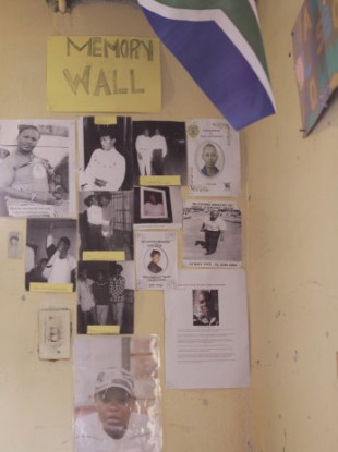 A memorial wall of photos shows well-known gay men and lesbians who have lived and died in Kwa Thema, east of Johannesburg