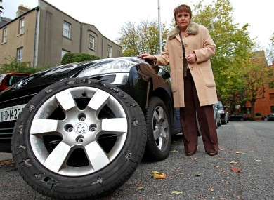 Dana stands by her campaign car and the badly damaged tyre.