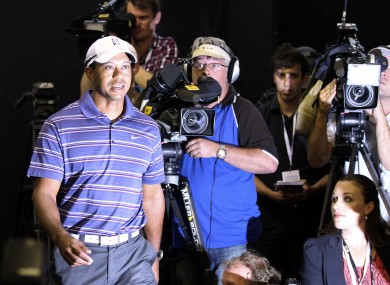 Tiger Woods arrives at the press conference in Australia earlier.