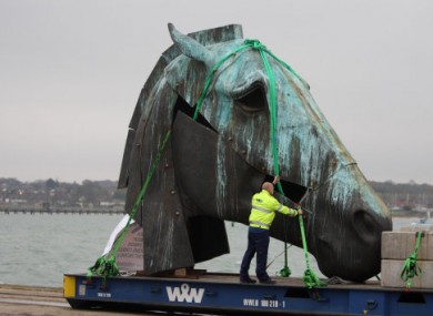 A bronze horse sculpture by Nic Fiddian-Green waits to be loaded onto a ship to Australia in Southampton today.