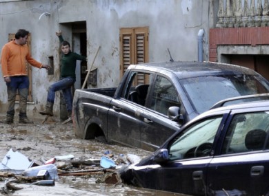 Cars are stucked in the mud in Scarcelli Saponara near Messina today.