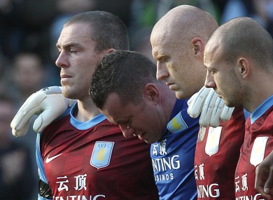 Shay Given and his Aston Villa teammates during the minute's silence for Gary Speed on Sunday. The inquest into his death opens today.