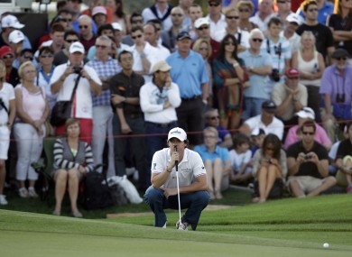 McIlroy lines up a shot on the 18th hole during the second round of the Dubai World Championship.
