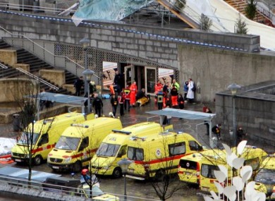 Emergency services on the scene of the attack in Liege today.