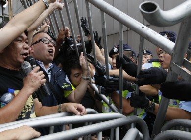 Democracy supporters protest against Beijing's crackdown on dissidents and clash with police on China's National Day in Hong Kong Saturday, Oct 1, 2011.