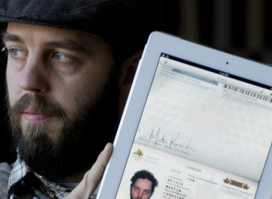 Martin Reisch with the scan of his passport on his iPad which he used to enter the US from Canada.