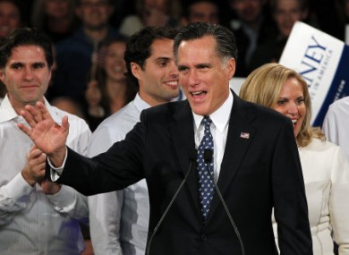Mitt Romney greets supporters at last night's primary.