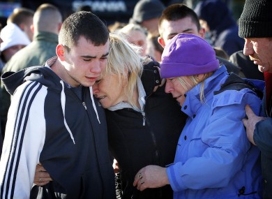 The family of Kevin Kershaw including mother Margaret (centre), brother Ciaran (left) and aunt Ann (right), walk behind the hearse containing his body after he became the second crew member to be recovered from the sea at Union Hall.
