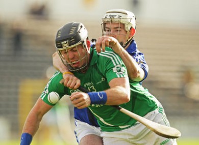 Leinster's Shane Dooley and Munster's Paul Murphy compete for possession.