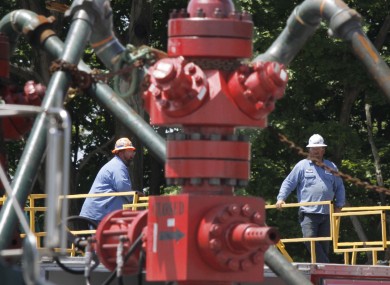 A pair of workers working on a fracking site in America (file photo)