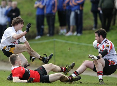 David Quinn of NUI Maynooth (left) scores past UCC's David Farry today.