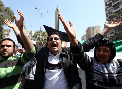 Anti-Syrian regime protesters chant slogans against Syrian President Bashar Assad during a demonstration in Beirut, Lebanon, Friday, April 6