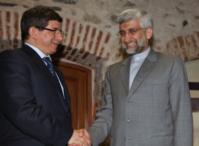 Turkey's Foreign Minister Ahmet Davutoglu, left, and Iran's Chief Nuclear Negotiator Saeed Jalili