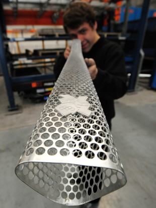 Quality check being carried out by a worker during the production of the Olympic torches at Coventry.