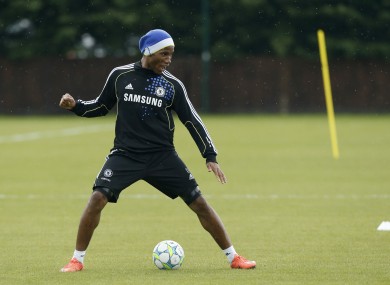 Didier Drogba stands over the ball during a Champions League final training session at Cobham this week.