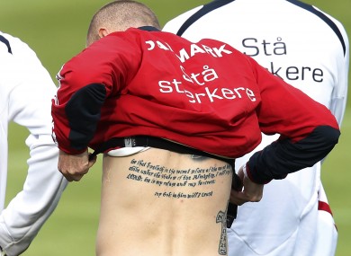 Danish player Niki Zimling adjusts his pulse meter during a training session this week.