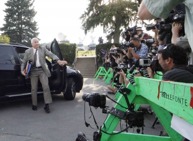 Former Penn State University assistant football coach Jerry Sandusky, left, arrives at the Centre County Courthouse.