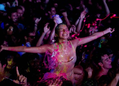 A reveler at a glow paint party in Spain early this morning