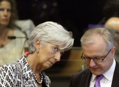 Managing Director of the International Monetary Fund Christine Lagarde, left, speaks with European Commissioner for the Economy Olli Rehn