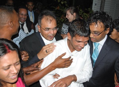 Avinash Treebhoowon, wearing the white shirt, outside the Supreme Court in Mauritius after he was acquitted of murder