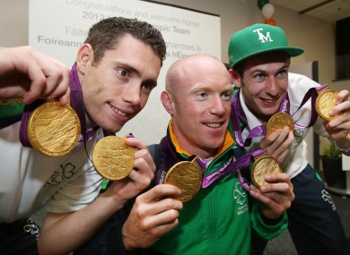 Jason Smyth, Mark Rohan and Michael McKillop each show off their two Paralympic gold medals.