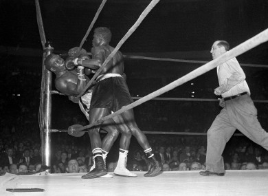 Emile Griffith, right, sends welterweight champion Benny