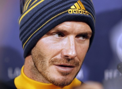 Los Angeles Galaxy's David Beckham talks with reporters during a news conference.