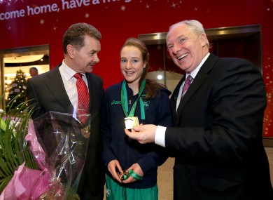 Professor Ciaran O'Cathain of Athletics Ireland, Fionnuala Britton with her medals and Minister of State for Sport Michael Ring.