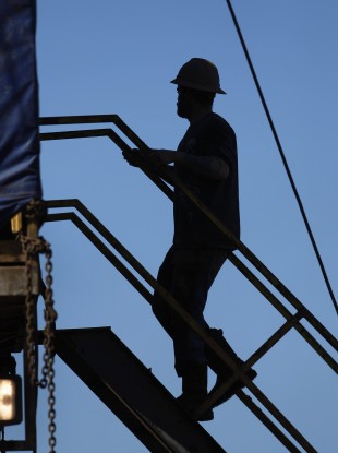 File photo of worker on fracking rig