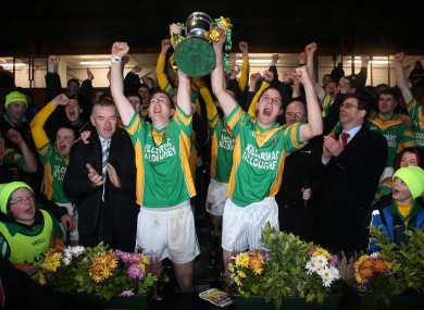ilcormac captain Ciaran Slevin (left) and John Grogan lift the cup.