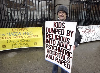 John Ayres protests outside the Dail as the Magdalene Laundries report is published.