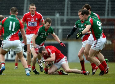 Cork's Graham Canty battles against the Mayo defence.