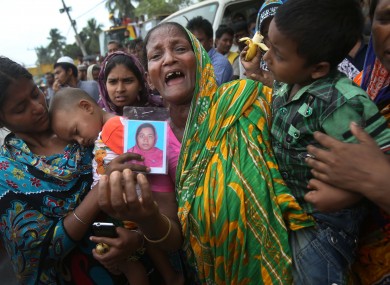 A woman grieves for her daughter-in-law who was trapped in the collapsed garment factory building in Bangladesh.