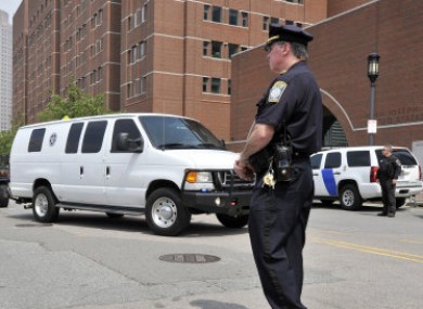 A U.S. Marshal's van, believed to be carrying Boston Marathon bombing suspect Dzhokhar Tsarnaev, arrives at the federal courthouse.