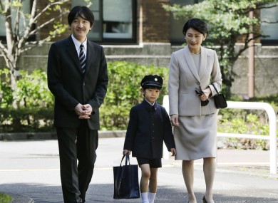 Prince Hisahito (centre) with his parents at his school in Tokyo