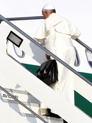 Pope Francis boards a plane at Rome's Fiumicino airport this morning
