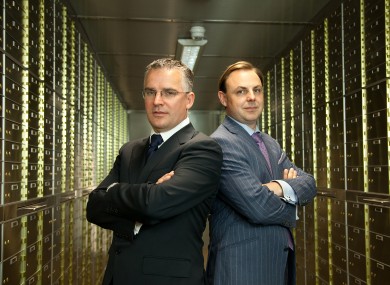 Seamus Fahy and David Walsh, standing in the vault amongst the safety deposit boxes.