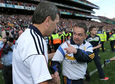 Cork manager Jimmy Barry Murphy shakes hands with Clare manager Davy Fitzgerald after today's game.