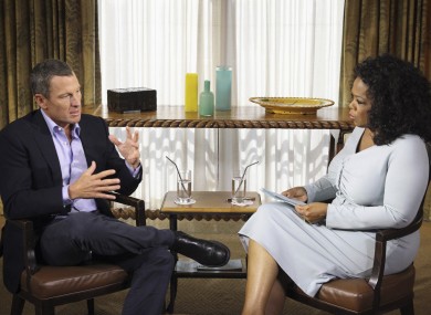 Oprah Winfrey interviewing cyclist Lance Armstrong during taping for the show