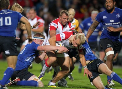 Ulster's Luke Marshall is wrapped up by the Leinster defence.
